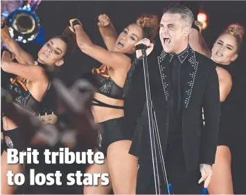  ??  ?? BRIT ICON AWARD: British singer Robbie Williams preforms during the Brit Awards.