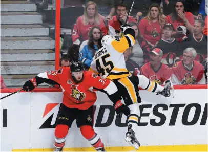  ?? CP PHOTO ?? Ottawa Senators defenceman Fredrik Claesson collides with Pittsburgh Penguins right winger Josh Archibald during Game 6 of the Eastern Conference final in Ottawa on Tuesday.