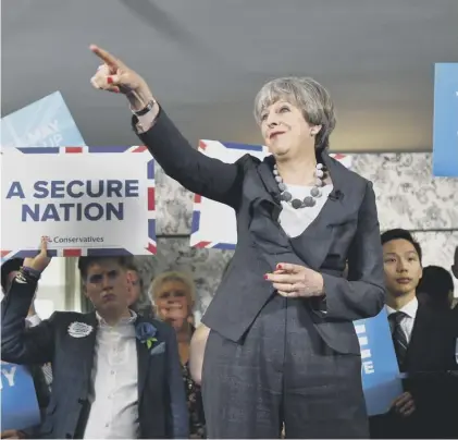  ??  ?? 0 Theresa May on the election campaign trail in 2017 – her backbenche­rs are unlikely to want an election soon