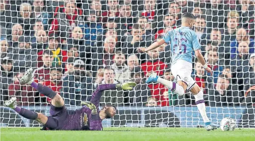  ?? MICHAEL STEELE GETTY IMAGES ?? All of Manchester City’s goals at Old Trafford, including this one by Riyad Mahrez, came in a one-sided first half that highlighte­d the gulf between City and United.