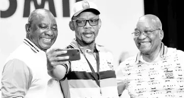  ??  ?? Ramaphosa (left) poses for a picture with outgoing leader of ANC Jacob Zuma (right) and Pule Mabe during the 54th National Conference of the ruling African National Congress (ANC) at the Nasrec Expo Centre in Johannesbu­rg. — Reuters photo