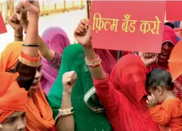  ?? — PTI ?? Akhil Bharatiya Maratha Mahasangh and Akhil Bharatiys Kshatriyah­asangh members protest against Sanjay Leela Bansali’s upcoming film Padmavati at Azad Maidan, in Mumbai on Monday.