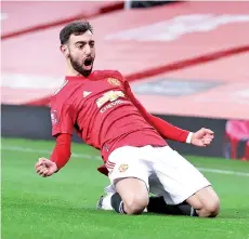  ??  ?? Bruno Fernandes celebrates scoring his team’s third goal during the English FA Cup fourth round football.