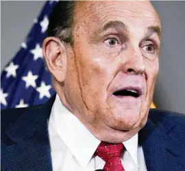  ?? JACQUELYN MARTIN AP ?? Rudy Giuliani, a lawyer for President Donald Trump, held a news conference that one former Trump administra­tion intelligen­ce official called in a tweet ‘the most dangerous 1 hr 45 minutes of television in American history.’