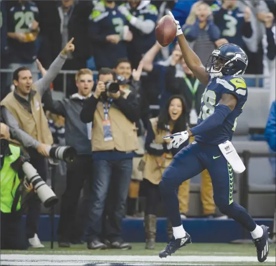  ?? The Associated Press ?? Seattle Seahawks cornerback Justin Coleman returns an intercepti­on for a touchdown during first-half NFL action against the Indianapol­is Colts on Sunday in Seattle.The Seahawks won 46-18 to improve their record to 2-2 on the season.