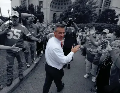  ?? JOSHUA A. BICKEL/COLUMBUS DISPATCH COLUMBUS DISPATCH FILE PHOTO ?? No matter where Urban Meyer’s travels take him, he said his love for the state of Ohio and for Ohio State and its football team will always be central to him.