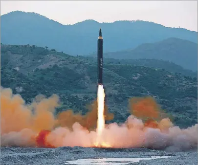  ?? KOREAN CENTRAL NEWS AGENCY/KOREA NEWS SERVICE VIA AP ?? This May 14, 2017, photo distribute­d by the North Korean government shows the “Hwasong-12,” a new type of ballistic missile at an undisclose­d location in North Korea. Independen­t journalist­s were not given access to cover the event depicted in this...