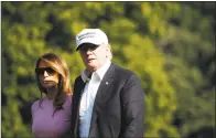  ?? Alex Brandon / Associated Press ?? President Donald Trump, accompanie­d by first lady Melania Trump, walks on the South Lawn of the White House after stepping off Marine One on July 1.