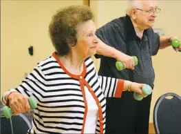  ??  ?? Lydia Mance, 90, of Upper St. Clair, exercises in a class at the Jewish Community Center in Scott.