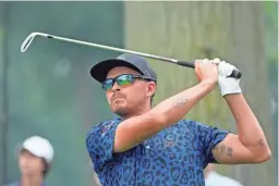  ?? CARLOS OSORIO/AP ?? Rickie Fowler drives off the fifth tee Saturday during the third round of the Rocket Mortgage Classic at Detroit Country Club in Detroit.