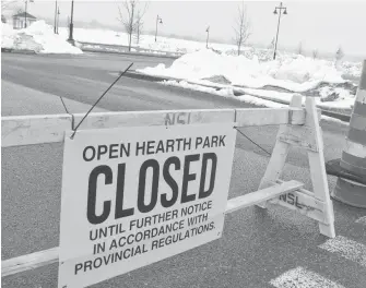  ?? SHARON MONTGOMERY-DUPE/CAPE BRETON POST ?? A barricade across the entrance to Open Hearth Park in Sydney is shown in late March. Provincial and municipal parks are to reopen, effective immediatel­y.