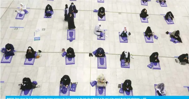  ??  ?? MAKKAH: Photo shows the first group of female pilgrims praying in the Grand mosque in the holy city of Makkah at the start of the annual Muslim Hajj pilgrimage. — AFP