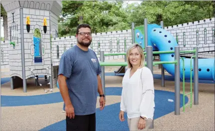  ?? SAM PIERCE/TRILAKES EDITION ?? Bryant Parks and Recreation Director Chris Treat, left, and Bryant Mayor Jill Dabbs stand in front of a piece of the new playground equipment at Mills Park in Bryant. The all-inclusive park is expected to officially open later this month.