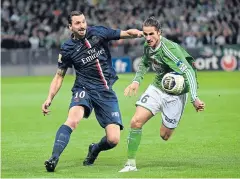  ?? AFP ?? PSG forward Zlatan Ibrahimovi­c, left, vies with St Etienne midfielder Jeremy Clement.