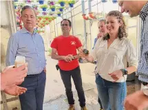  ?? Christine DeRosa/Hearst Connecticu­t Media ?? Gov. Ned Lamont tours DeFrancesc­o Farm with Katie Dykes, commission­er of the Connecticu­t Department of Energy and Environmen­tal Protection, in May 2022 in North Branford.