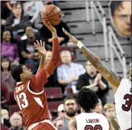  ?? Spurs and Feathers/ALLEN SHARPE ?? (13), who had 15 points in Saturday’s 77-65 loss to South Carolina, said the Razorbacks “just got to keep at it. Keep pushing, keep fighting. We’re going to get there.”