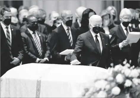  ?? AP PHOTO/EVAN VUCCI ?? President Joe Biden places his hand on the casket of former Secretary of State Madeleine Albright during the funeral service at the Washington National Cathedral, on Wednesday in Washington.