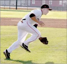  ?? PHOTO BY RICK PECK ?? McDonald County third baseman Emmanuel Baisch fields a slow roller to throw out a Neosho hitter during the Mustangs’ 2-1 loss on March 23 at MCHS.