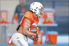  ?? [BRYAN TERRY/ THE OKLAHOMAN] ?? LEFT: Oklahoma State's Chuba Hubbard accounted for 535 yards from scrimmage over the last four games as the Cowboys' featured back late last season.