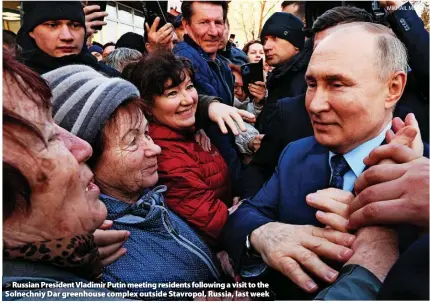  ?? MIKHAIL METZEL ?? Russian President Vladimir Putin meeting residents following a visit to the Solnechniy Dar greenhouse complex outside Stavropol, Russia, last week