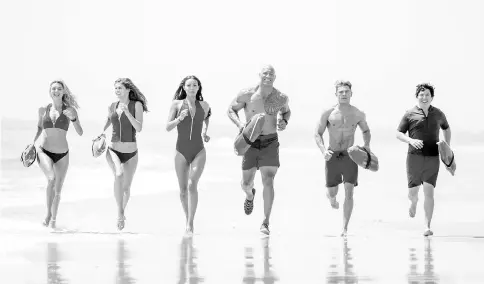  ??  ?? Rohrbach as CJ Parker, Alexandra Daddario as Summer, Ilfenesh Hadera as Stephanie Holden, Johnson as Mitch, Efron as Matt and Bass as Ronnie in ‘Baywatch’. — Photo courtesy of Paramount Pictures