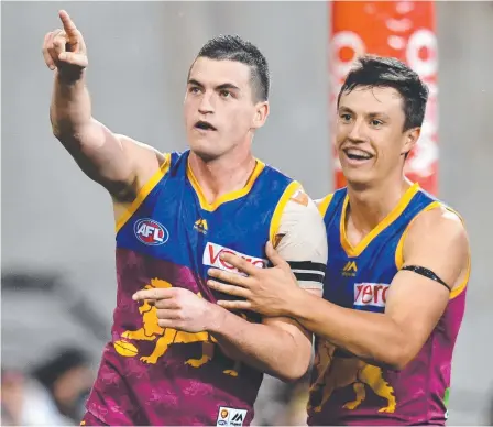  ?? Picture: AAP/Darren England ?? Tom Rockliff (left) could end up diluting Carlton’s draft should they sign the Lions star.