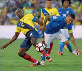  ?? — AP ?? Ecuador midfielder Walter Ayovi ( left) and Brazil defender Dani Alves vie for the ball in their Copa America Centenario Group B match at the Rose Bowl in Pasadena, California, on Saturday. The match ended goalless.