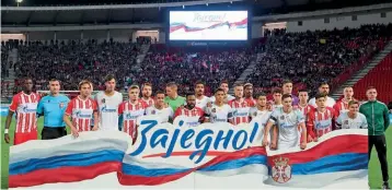  ?? ?? “Together”…Red Star Belgrade and Zenit Saint Petersburg players pose for a photo before their friendly at the Rajko Mitic Stadium