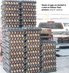  ?? APICHIT JINAKUL ?? Stacks of eggs are stocked in a store in Pathum Thani province.