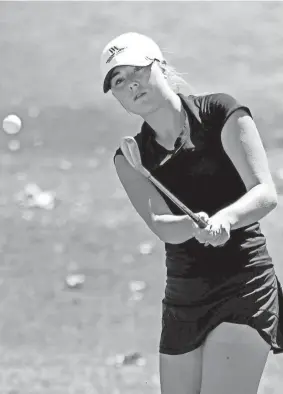  ?? PHOTOS BY CHRIS LANDSBERGE­R/THE OKLAHOMAN ?? Oklahoma Christian School's Brooklyn Benn hits a shot during the final round of the Class 3A state tournament Thursday at Westwood Park Golf Course in Norman.