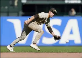  ?? JEFF CHIU - THE ASSOCIATED PRESS ?? FILE - San Diego Padres second baseman Adam Frazier field the ball during a baseball game against the San Francisco Giants in San Francisco, on Sept. 16, 2021. The Seattle Mariners acquired All-Star second baseman Adam Frazier from the San Diego Padres in exchange for two minor leaguers on Saturday.