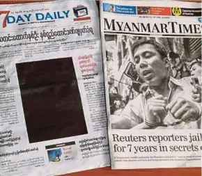  ?? EPA PIC ?? A black front page of ‘7Day Daily’ and a picture of Kyaw Soe Oo in handcuffs by the ‘Myanmar Times’ newspaper yesterday.