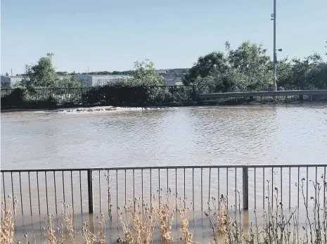  ?? ?? The road is flooded close to the Northern Spire junction.