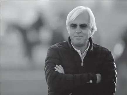  ?? Charlie Riedel, The Associated Press ?? Trainer Bob Baffert watches Tuesday morning’s workout at Churchill Downs. Baffert, who missed last year’s Kentucky Derby, has two horses in this year’s field: the favorite, Justify, and Solomini, given 30-1 odds.