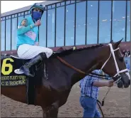  ?? (Arkansas Democrat-Gazette/Thomas Metthe) ?? Jockey Florent Geroux pumps his fist after riding C Z Rocket to victory in the $500,00 Count Fleet Sprint Handicap on Saturday at Oaklawn in Hot Springs. More photos at www.arkansason­line. com/411derby/