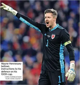  ?? CHRIS FAIRWEATHE­R/ HUW EVANS AGENCY ?? Wayne Hennessey bellows instructio­ns to his defence on his 100th cap.