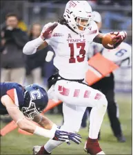  ?? Stephen Dunn / Associated Press ?? Temple wide receiver Isaiah Wright (13) scores in the first half against UConn on Saturday.