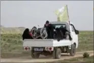  ?? ANHA VIA AP ?? In this Sunday image from video provided by Hawar News Agency, ANHA, an online Kurdish news service, civilians flee fighting near Baghouz, Syria.
