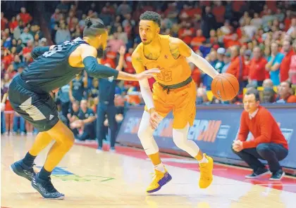  ?? ADOLPHE PIERRE-LOUIS/JOURNAL ?? New Mexico coach Paul Weir, right, watches as Lobo guard Anthony Mathis works against Nevada’s Caleb Martin on Jan. 5, when UNM scored a stunning 85-58 victory. The rematch of that game comes today in Reno, Nev.