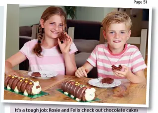  ??  ?? It’s a tough job: Rosie and Felix check out chocolate cakes