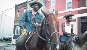  ?? Aaron Ricketts / Netflix ?? Idris Elba, left, as Harp and Caleb McLaughlin as Cole in “Concrete Cowboy.”