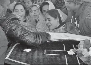  ?? AP/ARSHAD BUTT ?? Pakistani Christians mourn Monday during the funeral in Quetta, Pakistan, for a family member killed in Sunday’s suicide bombing of a church.