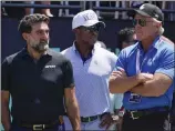  ?? SETH WENIG — THE ASSOCIATED PRESS, FILE ?? Yasir Al-Rumayyan, left, governor of Saudi Arabia's Public Investment Fund, Majed Al-Sorour, CEO of
Golf Saudi, center, and Greg Norman, CEO of LIV Golf, watch at the first tee during a tournament in July.