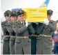  ??  ?? Soldiers carry the flagdraped coffins of the 11 Ukrainians who died in a plane mistakenly shot down by Iran at Kiev's Boryspil airport on Sunday