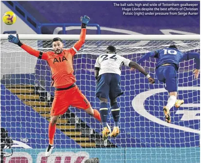  ??  ?? The ball sails high and wide of Tottenham goalkeeper Hugo Lloris despite the best efforts of Christian Pulisic (right) under pressure from Serge Aurier