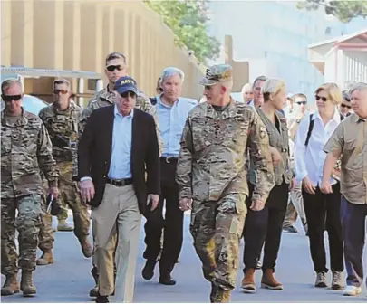  ?? PHOTO COURTESY OF JOHN MCCAIN TWITTER ACCOUNT ?? ON THE FRONT LINES: Bay State U.S. Sen. Elizabeth Warren, second from right, joined Arizona U.S. Sen. John McCain on a trip to Camp Resolute in Afghanista­n yesterday.