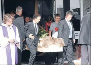  ??  ?? Final journey: Family carry Olive Baldwin’s coffin out of St Paul’s in Paraparaum­u last Wednesday.