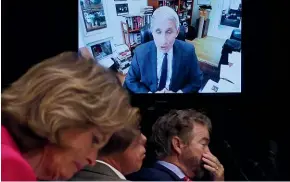  ?? AP ?? Senators listen as Dr Anthony Fauci, director of the National Institute of Allergy and Infectious Diseases, speaks remotely during a Senate Committee for Health, Education, Labour, and Pensions hearing.