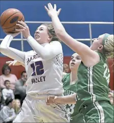  ?? Matt Freed/Post-Gazette ?? Chartiers Valley’s Mackenzie Wagner drives to the basket Monday against visiting South Fayette. Wagner scored 15 points as Chartiers Valley won, 57-40.