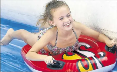  ?? 2926791 ?? All going downhill but in a good way. Grace Robbins, 12, was one of hundreds of riders who tried out Sutton Valence’s water slide on Saturday